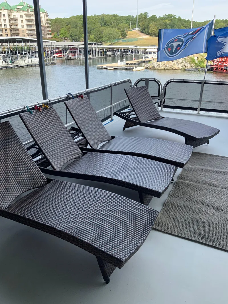 Slide: The Image of Four lounge chairs on the deck of a 2003 Sharpe 75' Houseboat. - 42