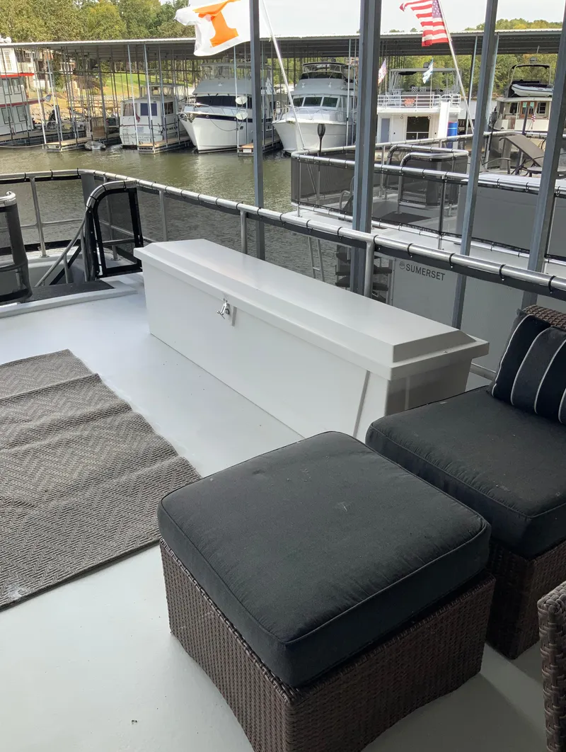 Slide: The Image of 2003 Sharpe 75' Houseboat deck with seating and storage chest. - 43