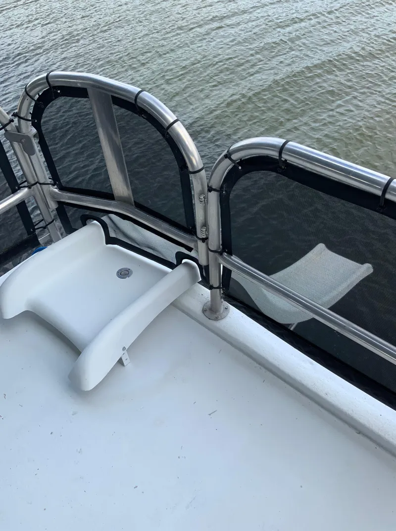 Slide: The Image of 2003 Sharpe 75' Houseboat deck with railing and water view. - 45