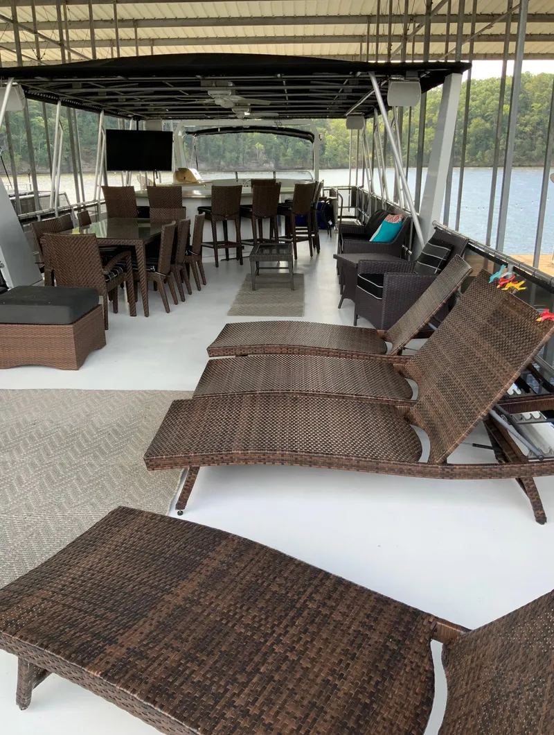 Slide: The Image of 2003 Sharpe 75' Houseboat with outdoor seating and lounge chairs on deck. - 46