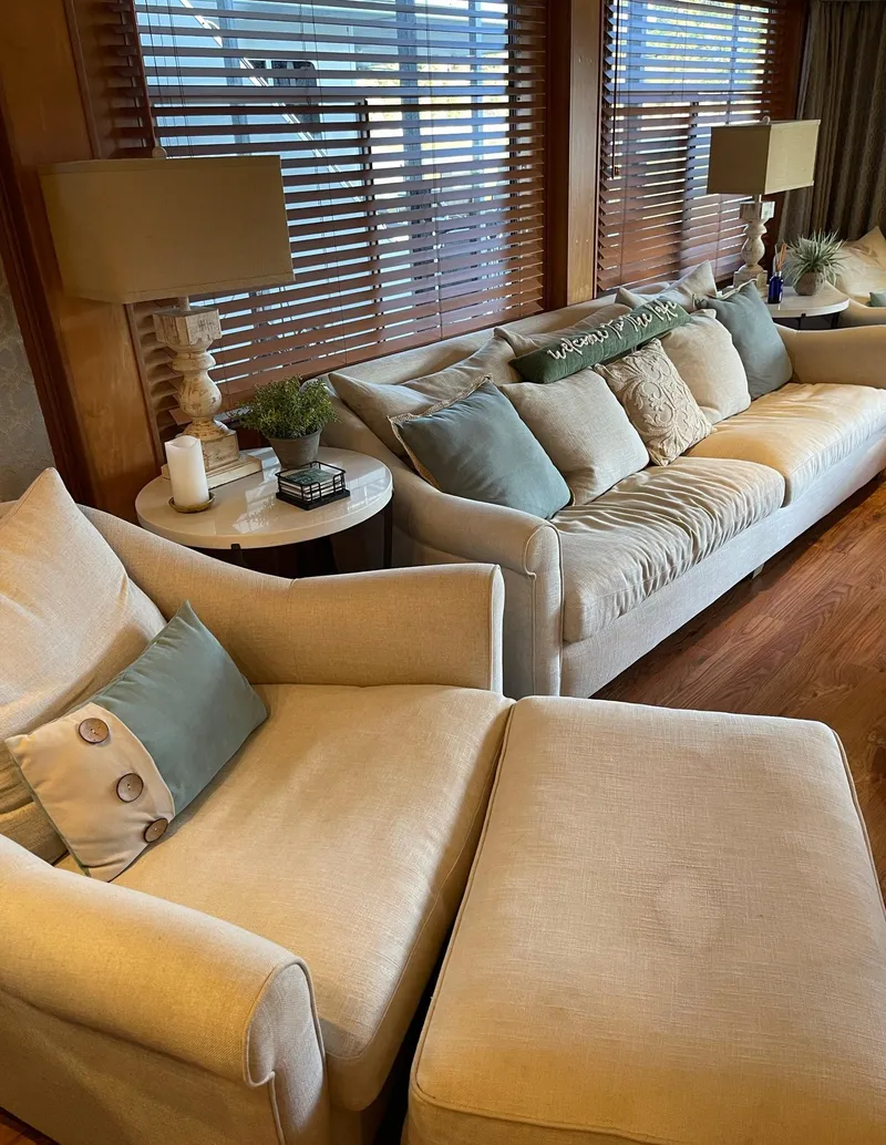 Slide: The Image of Luxurious interior of a 2003 Sharpe 75' Houseboat with cozy seating and elegant decor. - 6