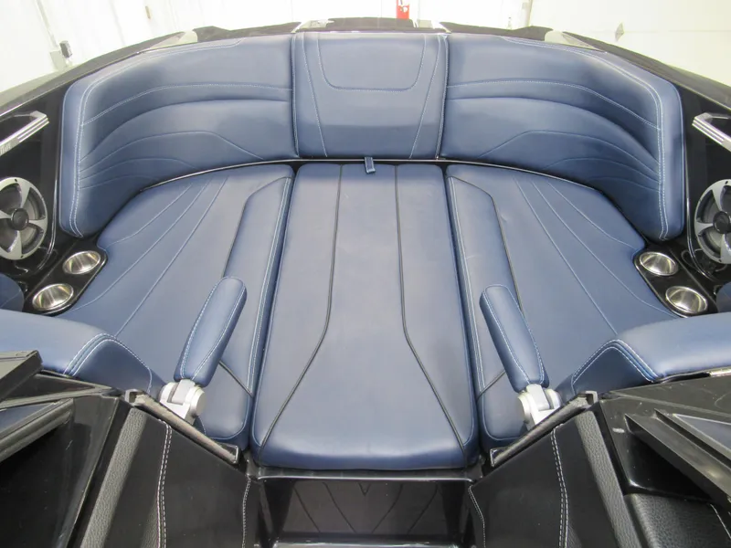 Slide: The Image of 2019 Malibu Wakesetter 24 MXZ interior with blue leather seating. - 15