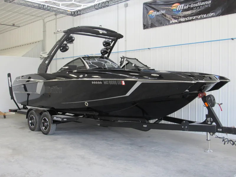 Slide: The Image of 2019 Malibu Wakesetter 24 MXZ boat on trailer in indoor storage. - 4