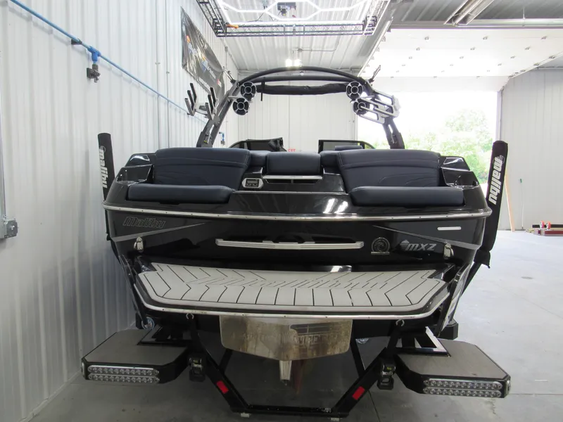 Slide: The Image of 2019 Malibu Wakesetter 24 MXZ boat in a storage facility. - 8