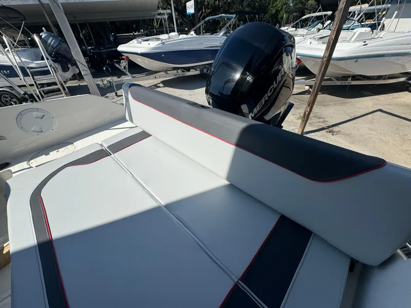 Slide: The Image of 2024 Bayliner Element M19 boat with Mercury outboard engine, rear seating area. - 8