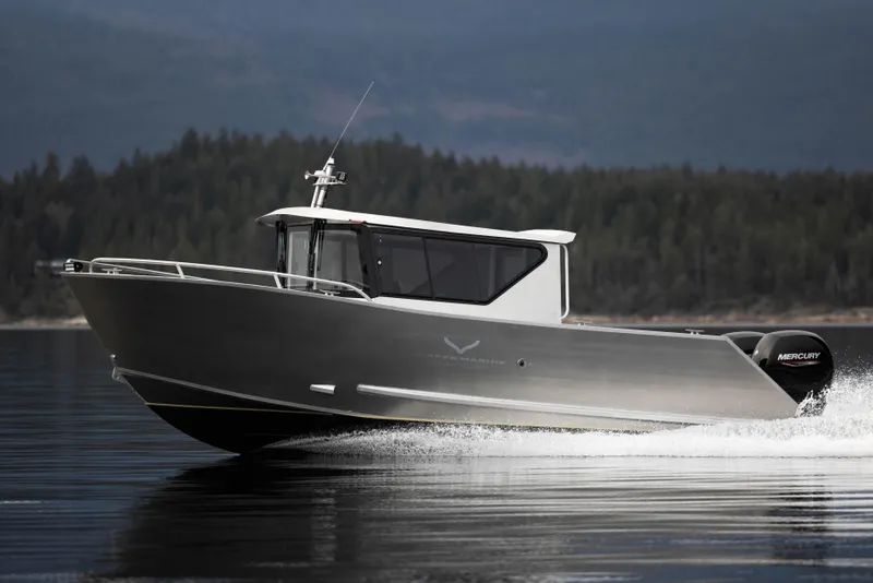 Slide: The Image of 2025 Jasper Marine Defender 22 boat cruising on a calm lake. - 20