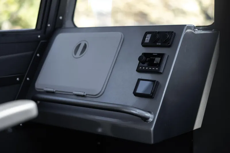 Slide: The Image of Control panel of 2025 Jasper Marine Defender 22 boat with modern navigation equipment. - 30