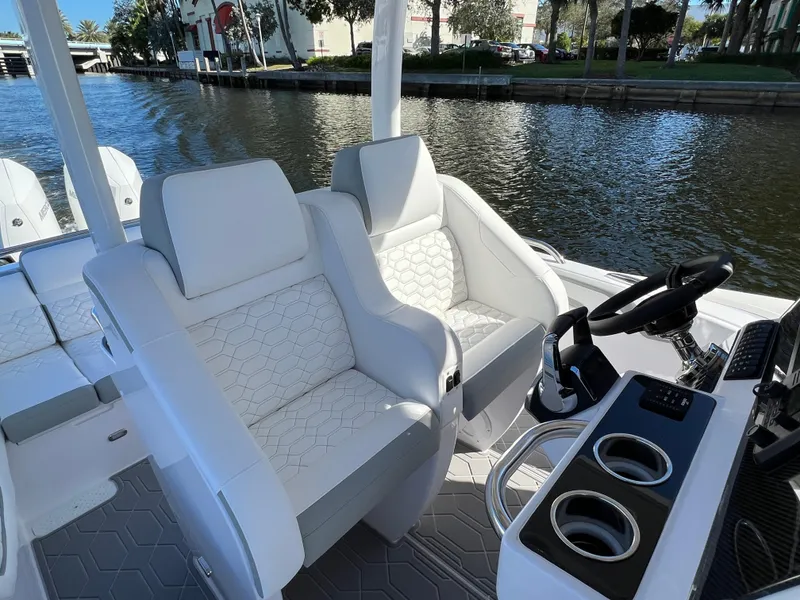 Slide: The Image of Luxury seating on the 2024 Airship 340 boat, featuring modern design and waterfront view. - 10