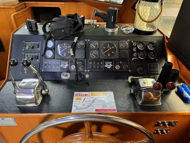 Slide: The Image of Control panel of a 1989 Jefferson Motoryacht with various gauges and equipment. - 11
