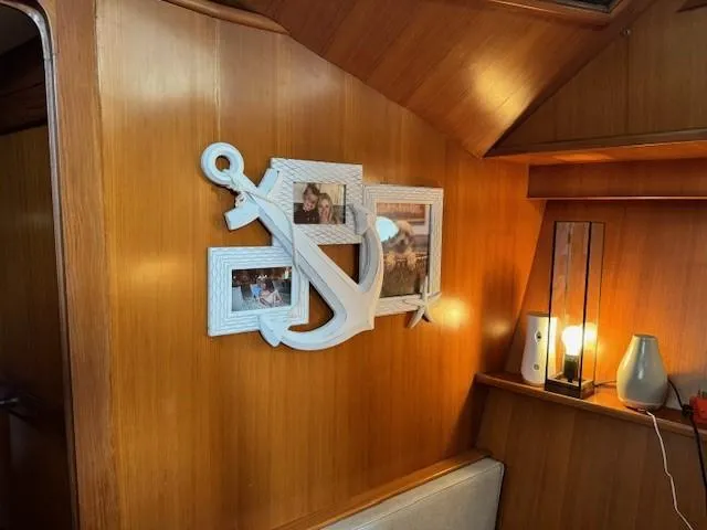 Slide: The Image of Decorative anchor photo frame on wooden wall of 1989 Jefferson Motoryacht interior. - 13