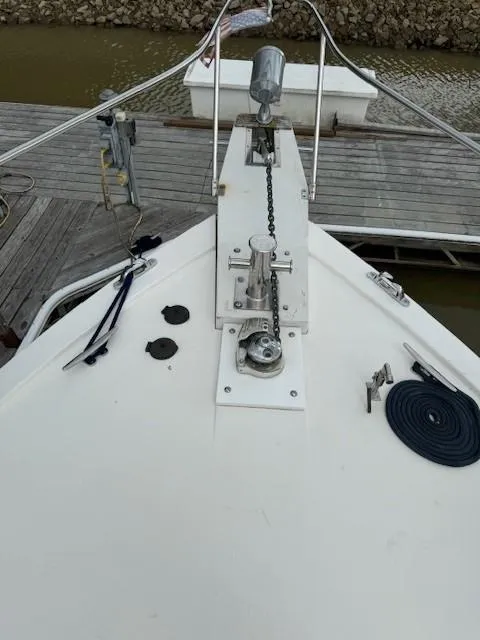 Slide: The Image of 1989 Jefferson Motoryacht bow with anchor chain and dock in background. - 20