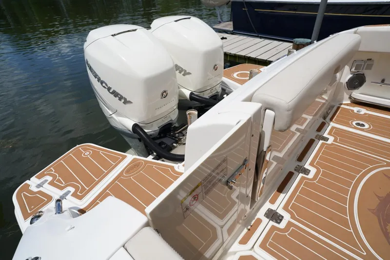 Slide: The Image of 2016 Boston Whaler 320 Vantage with twin Mercury outboard engines docked. - 21