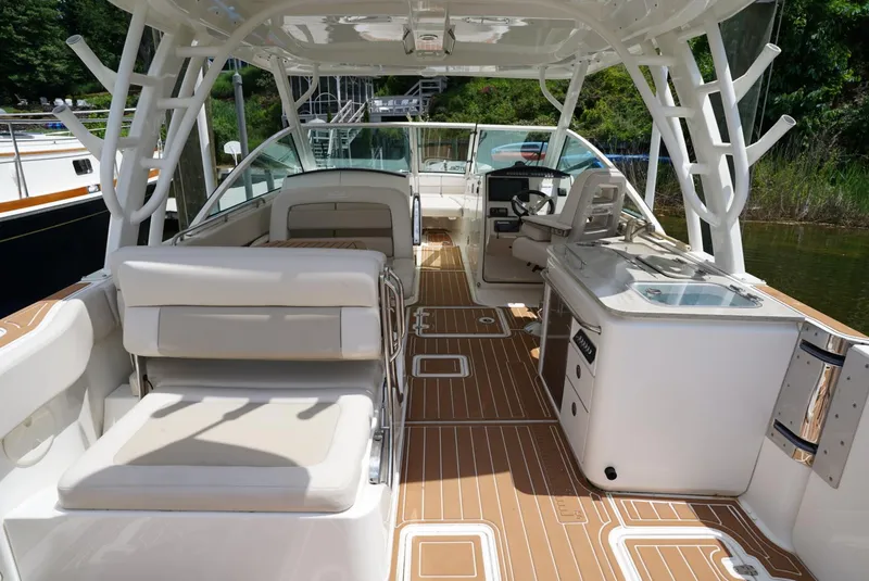 Slide: The Image of 2016 Boston Whaler 320 Vantage boat interior with seating and helm station. - 23