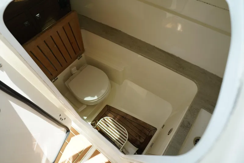 Slide: The Image of Interior view of 2016 Boston Whaler 320 Vantage boat bathroom. - 25