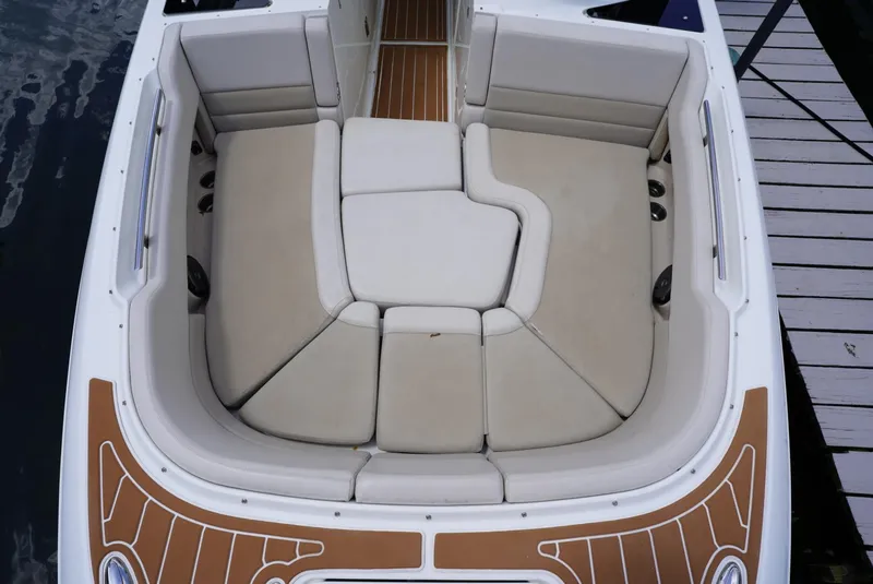 Slide: The Image of 2016 Boston Whaler 320 Vantage boat with spacious cushioned seating area. - 3