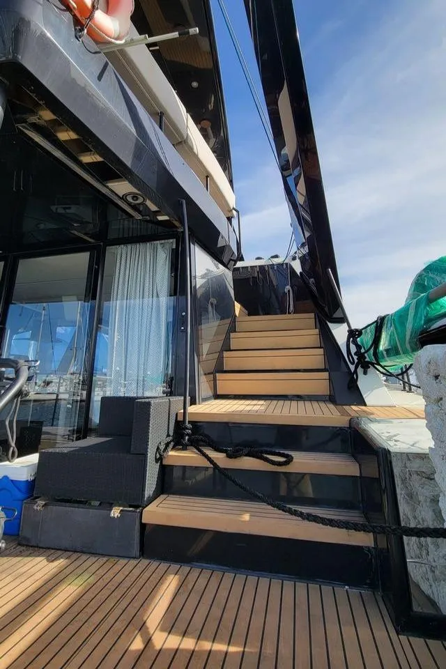 Slide: The Image of Luxury yacht Hussar WAVE 50, 2022 model, with wooden deck and stairs. - 3