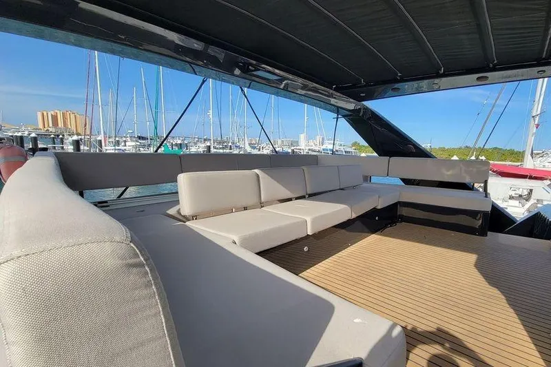 Slide: The Image of Spacious deck seating on 2022 Hussar WAVE 50 yacht in marina. - 5