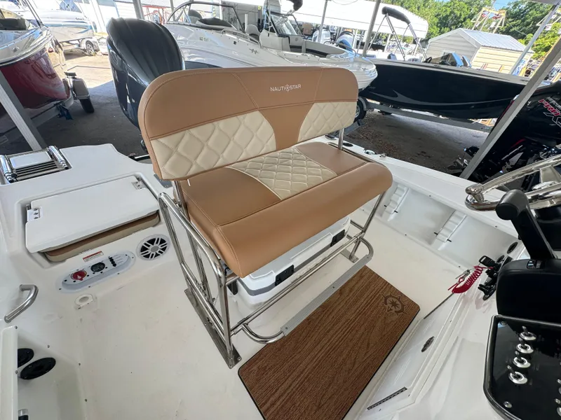 Slide: The Image of 2024 NauticStar 191 Hybrid boat interior with tan and white seating. - 3