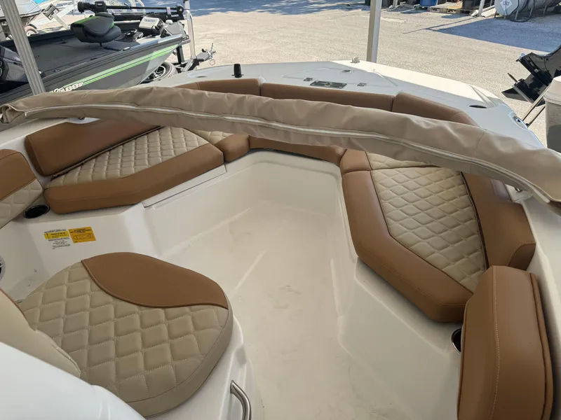 Slide: The Image of 2024 NauticStar 191 Hybrid boat interior with tan quilted seating. - 6