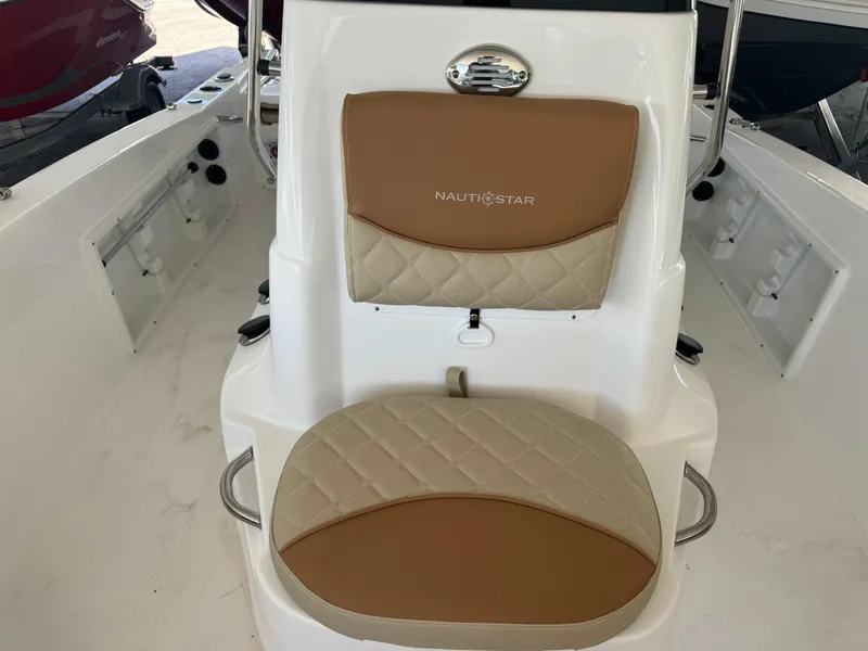 Slide: The Image of 2024 NauticStar 191 Hybrid boat with tan and beige cushioned seating. - 7