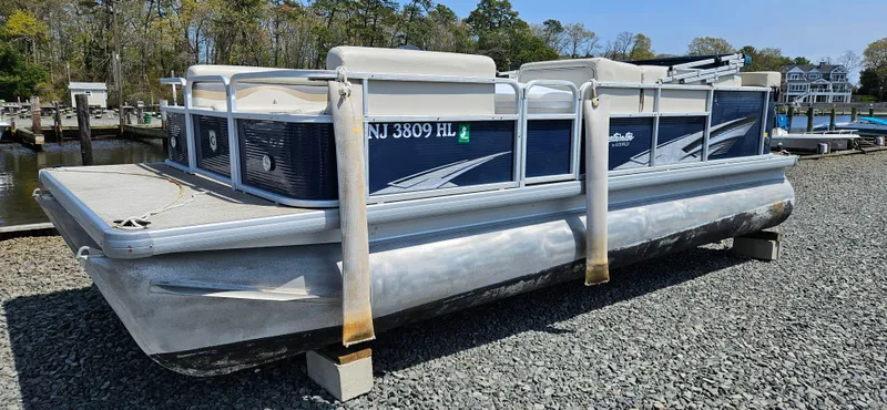 Slide: The Image of 2018 Sweetwater Sunrise 226 C pontoon boat on gravel lot. - 1