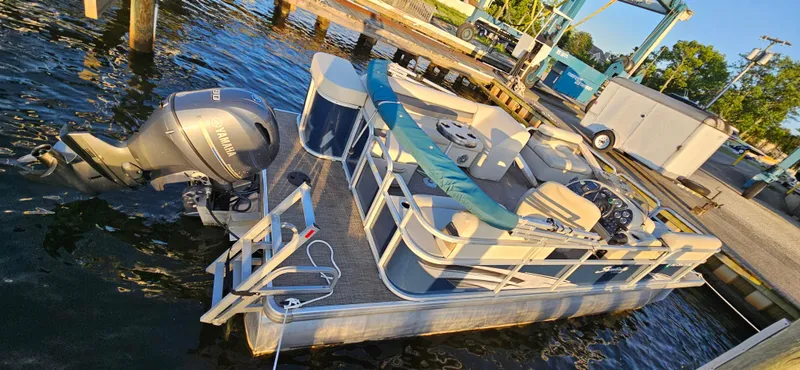 Slide: The Image of 2018 Sweetwater Sunrise 226 C pontoon boat docked at marina. - 13