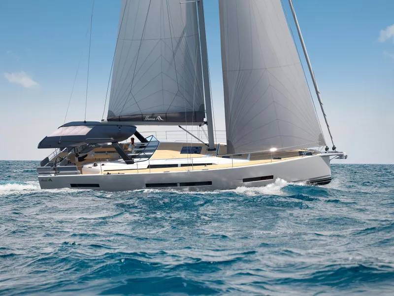Slide: The Image of 2025 Hanse 590 yacht sailing on open sea under clear blue sky. - 42
