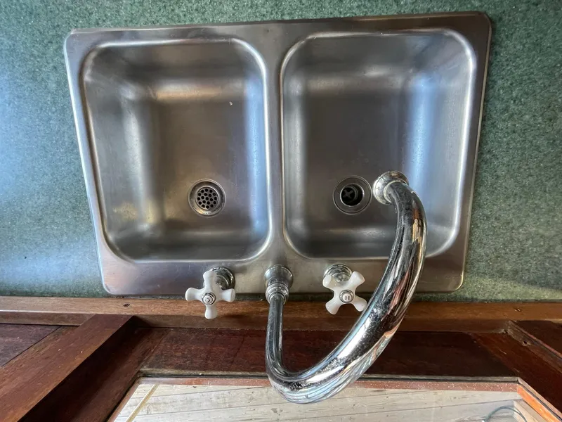 Slide: The Image of Vintage double sink with chrome faucet in 1931 Jensen Cruiser. - 20