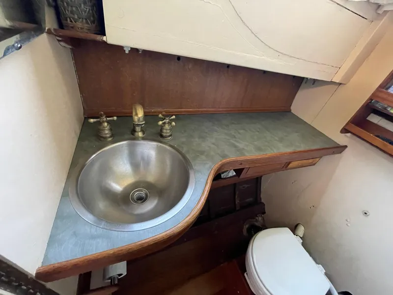 Slide: The Image of 1931 Jensen Cruiser bathroom with stainless steel sink and vintage fixtures. - 25