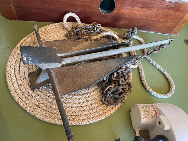 Slide: The Image of Vintage boat anchor with chain and rope on a Jensen Cruiser, 1931 model. - 38