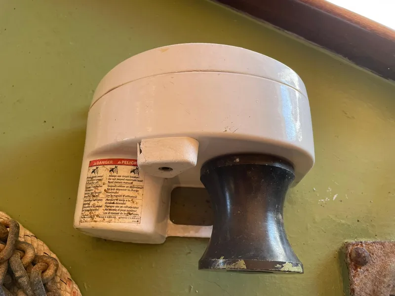 Slide: The Image of Wall-mounted vintage marine winch on green background, Jensen Cruiser 1931 model. - 39