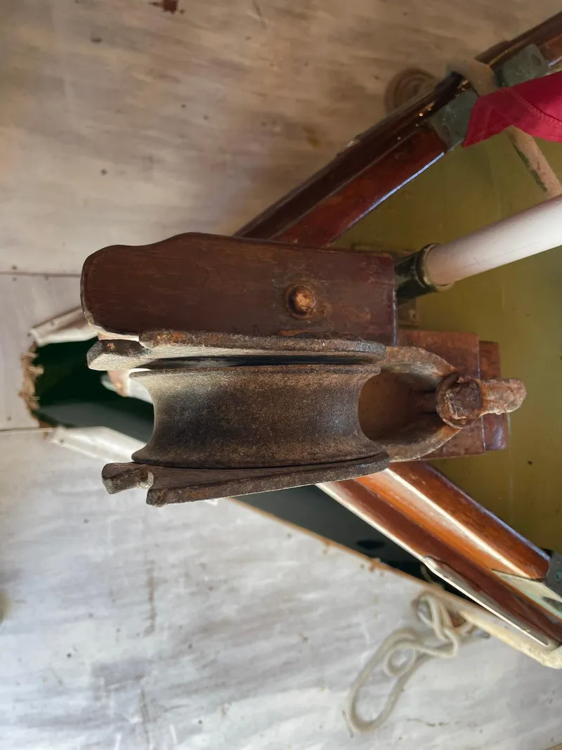 Slide: The Image of Close-up of a vintage 1931 Jensen Cruiser boat component with wooden and metal details. - 41