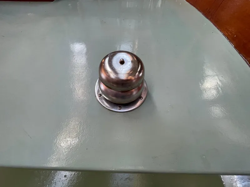 Slide: The Image of Metallic fixture on a Jensen Cruiser 1931 boat's surface. - 45