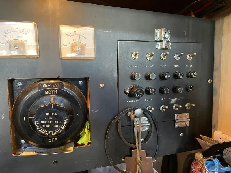 Slide: The Image of 1931 Jensen Cruiser control panel with vintage gauges and switches. - 46