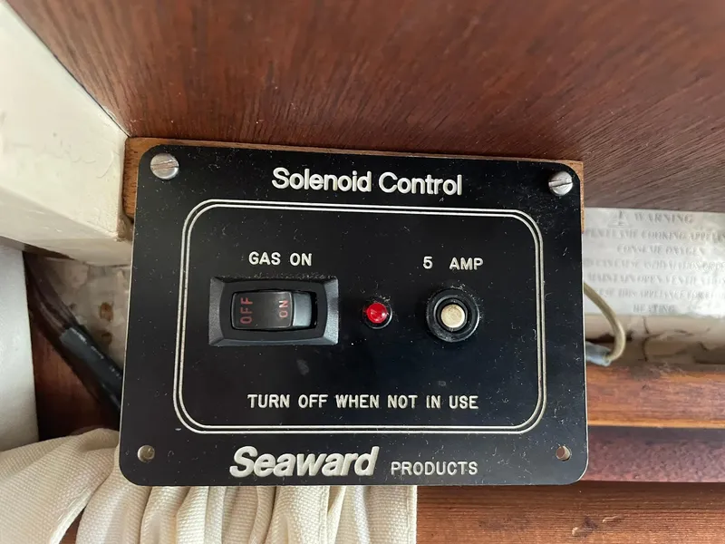 Slide: The Image of Seaward solenoid control panel in 1931 Jensen Cruiser, featuring gas switch and 5 amp indicator. - 48