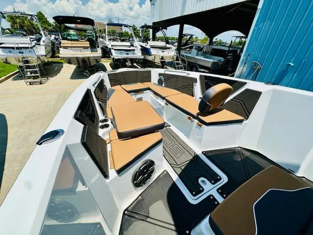 Slide: The Image of 2023 Scarab 255 Open ID boat with tan seating and modern interior design. - 15
