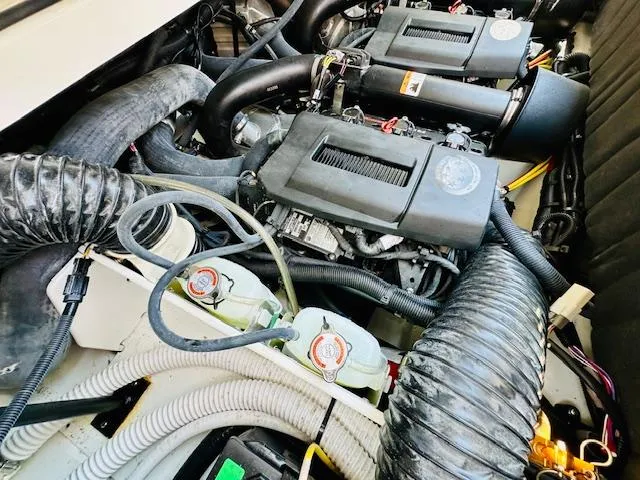 Slide: The Image of 2023 Scarab 255 Open ID engine compartment with dual engines and wiring. - 21