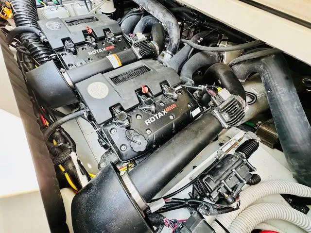 Slide: The Image of 2023 Scarab 255 Open ID boat engine compartment with Rotax engines. - 22