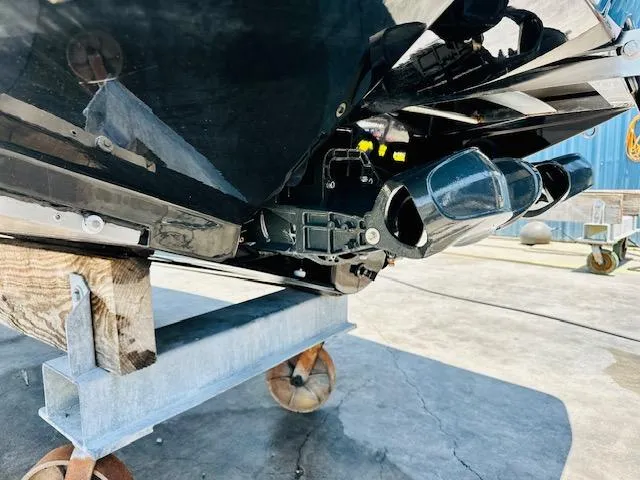 Slide: The Image of 2023 Scarab 255 Open ID boat on a trailer, close-up of the hull and jet drive. - 4