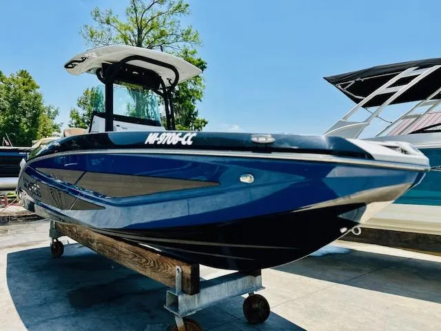 Slide: The Image of 2023 Scarab 255 Open ID boat on display in marina. - 6