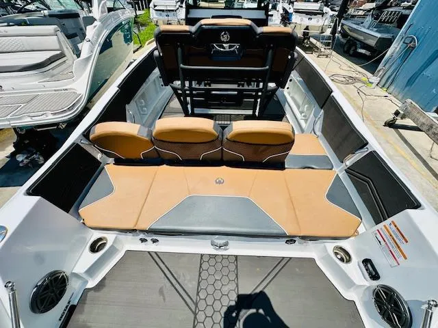 Slide: The Image of 2023 Scarab 255 Open ID boat with tan seating and modern design. - 8
