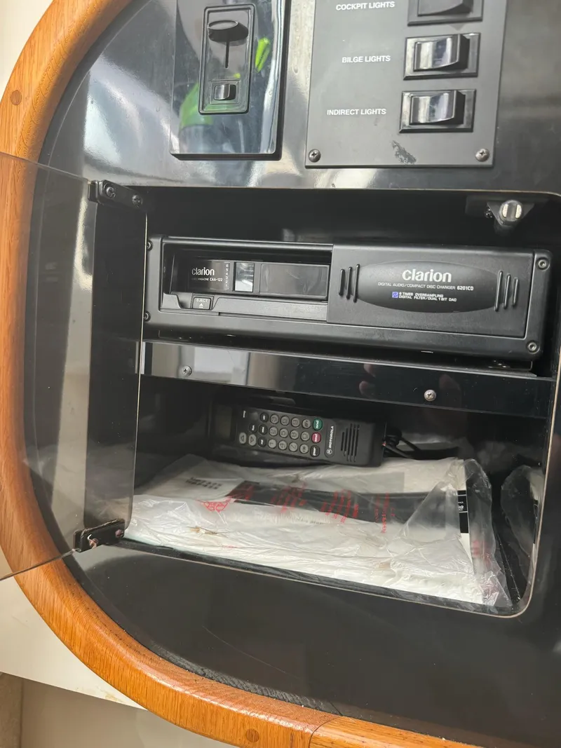 Slide: The Image of Control panel of a 1995 Sea Ray 500 with Clarion audio system and remote. - 11