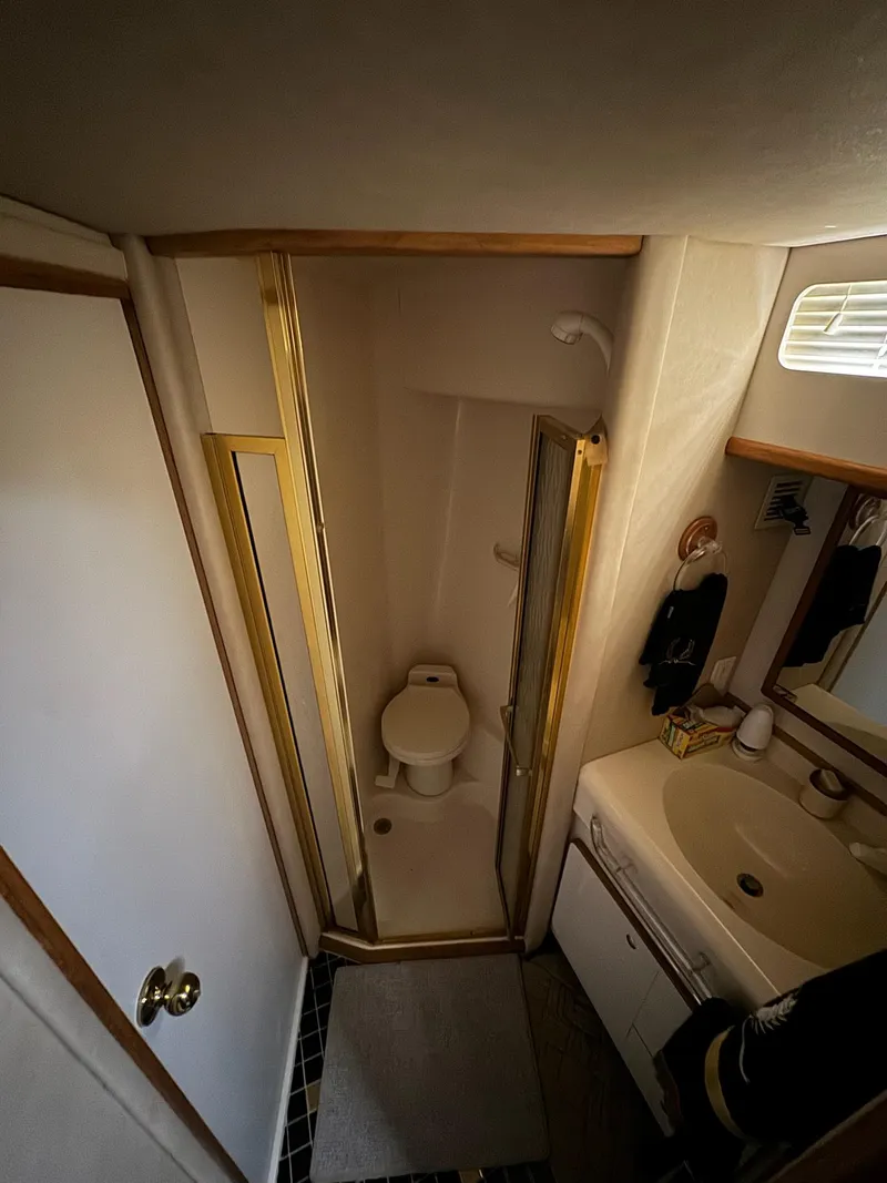 Slide: The Image of Bathroom interior of 1995 Sea Ray 500 yacht with shower, toilet, and sink. - 17