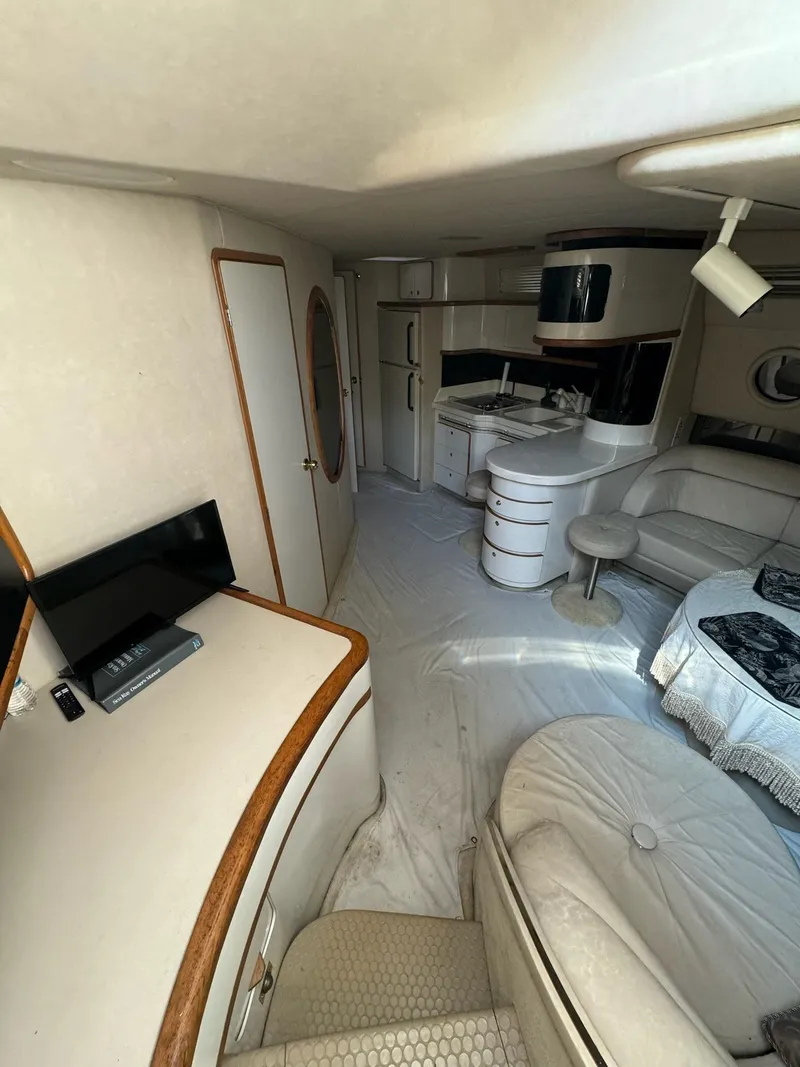 Slide: The Image of Interior of a 1995 Sea Ray 500 yacht with modern amenities and cozy seating. - 19