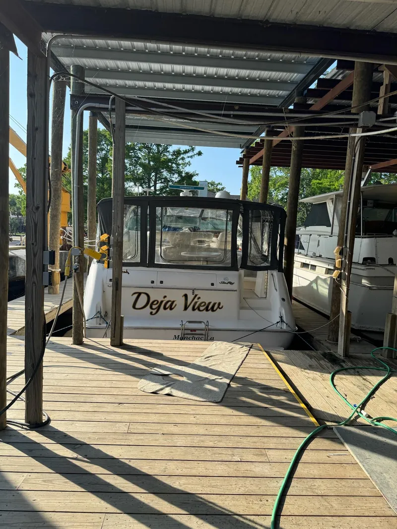 Slide: The Image of 1995 Sea Ray 500 yacht named "Deja View" docked at marina. - 27