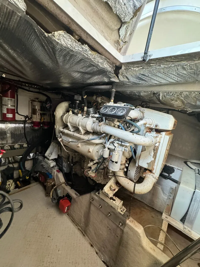 Slide: The Image of Engine room of a 1995 Sea Ray 500 yacht, showcasing detailed machinery and components. - 28
