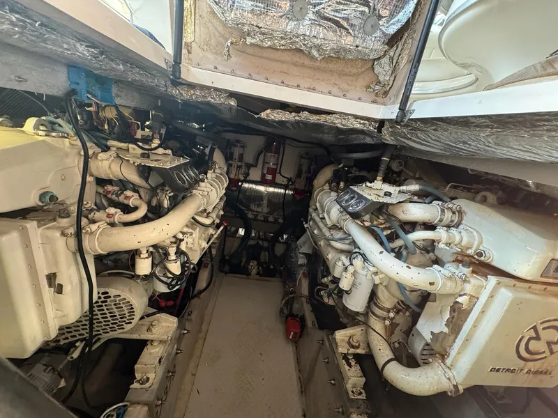 Slide: The Image of Engine room of a 1995 Sea Ray 500 yacht, featuring Detroit Diesel engines. - 29