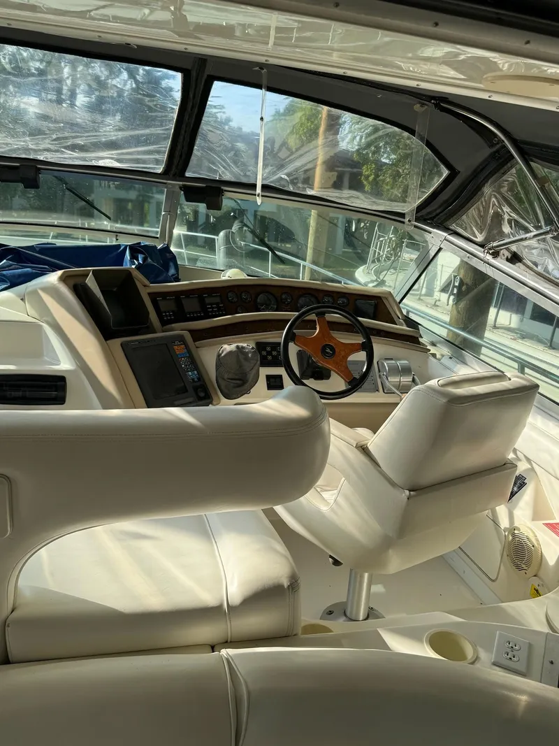 Slide: The Image of Interior of 1995 Sea Ray 500 yacht with steering wheel and dashboard. - 4