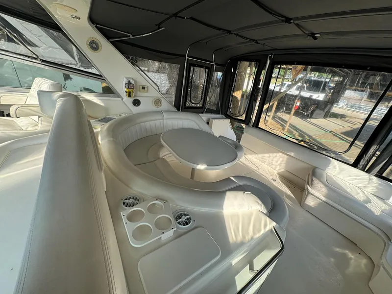 Slide: The Image of Luxurious interior of 1995 Sea Ray 500 yacht with white seating and table. - 7