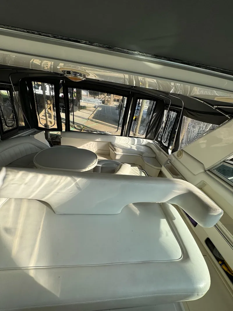Slide: The Image of Interior of 1995 Sea Ray 500 yacht with white leather seating and table. - 8